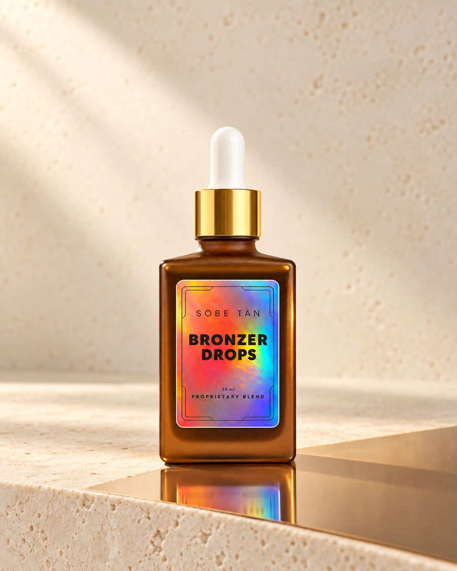 SoBe Tan Bronzer Drops amber dropper bottle on cream stone