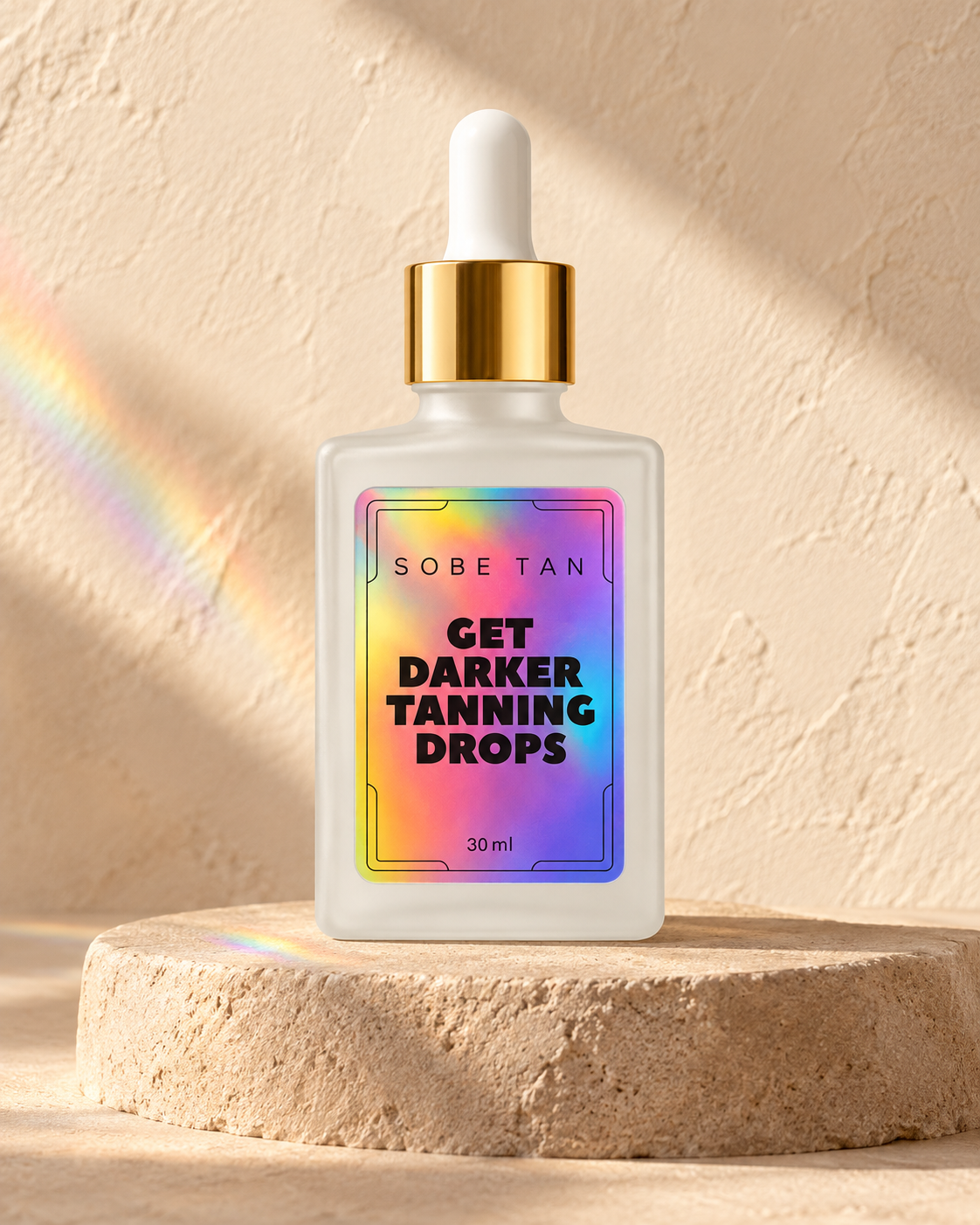 Get Darker Tanning Drops frosted bottle on a sand pedestal