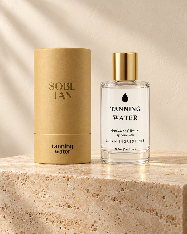 SoBe Tan Tanning Water bottle and kraft tube on warm travertine