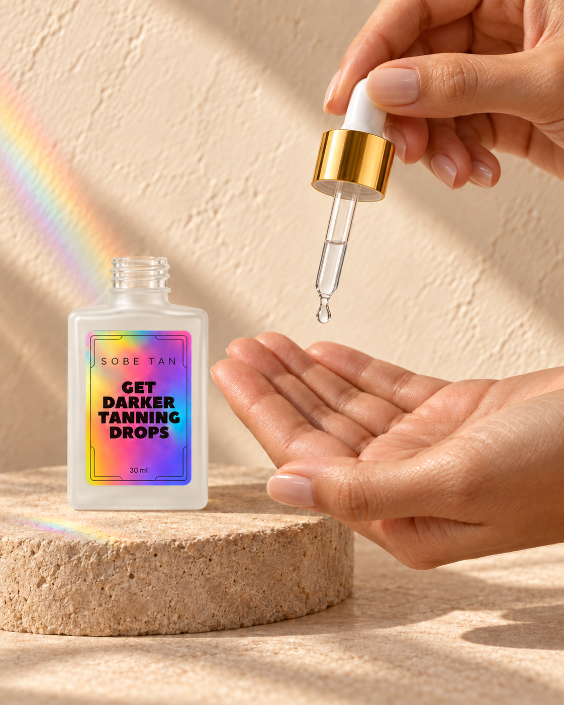 A clear drop of Get Darker Tanning Drops released into an open palm